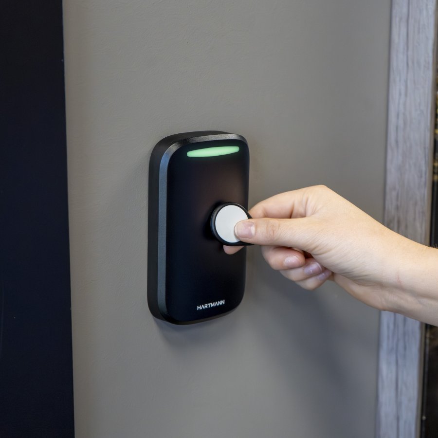 Hartmann AX-20 proximity reader with key fob held to the face for entry